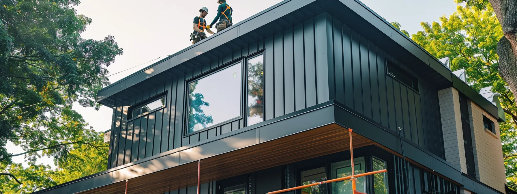 a group of contractors expertly installing sleek aluminium siding on a house in kitchener.